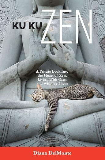 The image depicts the cover of a book titled "KU KU ZEN" by Diana DelMonte. The cover features a large sculpture of a seated figure, possibly a Buddha, with hands positioned in a meditative gesture. A sleeping tabby cat is curled up on the figure's hands, adding a serene touch to the scene. The background is textured stone, complementing the overall theme of peace and tranquility. The subtitle reads, "A Private Look Into the Heart of Zen, Living With Cats, and Without Them."