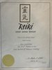 The image shows a certificate for Reiki, specifically identifying it as "Usui Shiki Ryoho." It includes a decorative header with Japanese characters, and the text states that it certifies an individual named Diane Hudock for completing the First Degree in the Usui System of Natural Healing. The document features a gold seal at the bottom and is signed by Dr. Stephen P. Schubert, dated June 29, 1997.