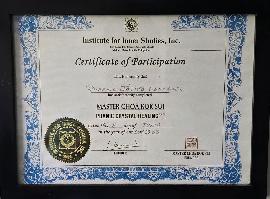 The image depicts a framed certificate of participation from the Institute for Inner Studies, Inc. It certifies that an individual has completed a course titled "Master Choa Kok Sui Pranic Crystal Healing." The certificate includes decorative borders, an emblem or seal, and is dated the 6th day of June in the year 2023. The bottom of the certificate features the signatures of a lecturer and Master Choa Kok Sui, the founder.