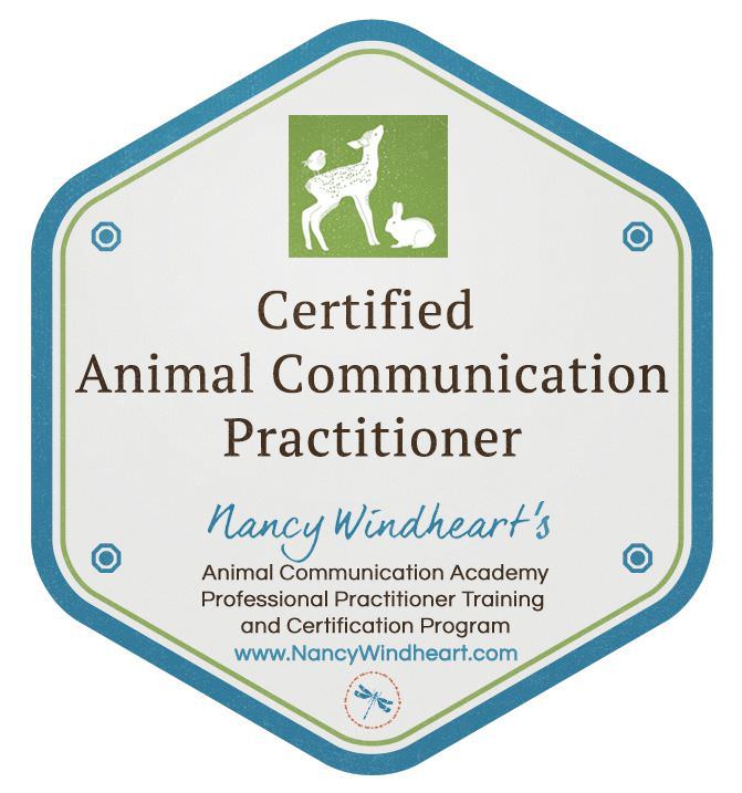 The image shows a certification badge or emblem for "Certified Animal Communication Practitioner." It features a green and white color scheme and includes illustrations of a deer and a rabbit. The text on the badge includes the name of the program and a website link. The overall shape of the badge is hexagonal with a decorative border.