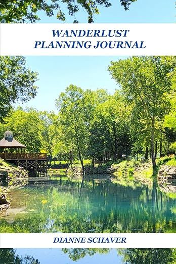 The image depicts the cover of a journal titled "Wanderlust Planning Journal" by Dianne Schaver. The cover features a serene landscape with a body of water surrounded by lush green trees. There is a structure resembling a gazebo or platform on the left side, partially overhanging the water. The overall feel of the image is peaceful and inviting, suitable for themes of travel and exploration. The title and author's name are prominently displayed at the top and bottom in bold text.