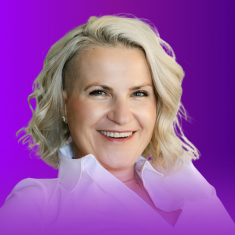 The image features a person with light blonde, wavy hair styled in a casual manner. They are smiling and appear to be wearing a white shirt with a collar. The background has a gradient that transitions from purple to a lighter shade, enhancing the overall aesthetic of the image.