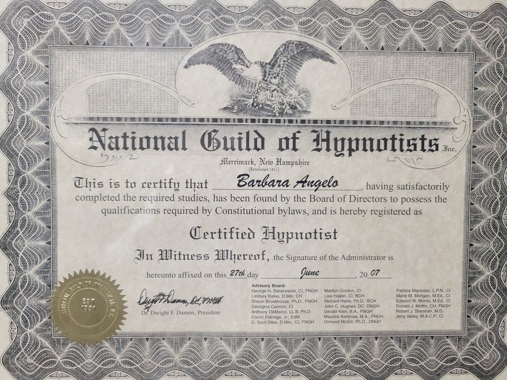 The image shows a certificate from the National Guild of Hypnotists, issued in Merrimack, New Hampshire. The certificate includes an ornate design with an eagle at the top. It certifies an individual as a "Certified Hypnotist" after completing required studies. The document features a seal, the date of issuance, and signatures, indicating official recognition. The background has a decorative border.