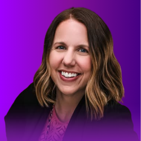 The image features a woman with shoulder-length, wavy hair and a warm smile. She is wearing a dark blazer over a light-colored top. The background is a gradient of purple tones.