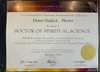 The image depicts a diploma or certificate awarded by a seminary and college of philosophy. It states that it confers the degree of "Doctor of Spiritual Science" to an individual. The document includes the date of issuance, the location (Los Angeles, California), and quotes a statement by the founder, along with signatures from the Spiritual Director, President, and Dean of the Seminary. There is also a gold seal on the certificate, indicating its authenticity. The background features a gradient design that includes various colors.