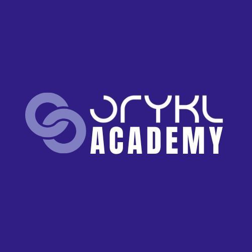 The image features a logo for "ORYKL ACADEMY." The background is a solid purple color, and the logo consists of stylized letters and elements. The letters "ORYKL" are in a prominent font, with "ACADEMY" placed below it. There is a visual element that resembles two interlocking shapes or loops, which are colored in a lighter hue.