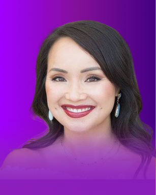 The image features a woman smiling, with long, dark hair. She is wearing noticeable earrings and has a bright red lip color. The background of the image transitions from purple to a lighter shade. The overall impression is vibrant and cheerful.