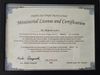 The image depicts a certificate titled "Ministerial License and Certification" from the Dolphin Star Temple Mystery School. It states that a person named Mr. Roberto Jativa has completed Full Sensory Perception Levels 1, 2, and 3. The text highlights his dedication to spiritual transformation and acknowledges his role in assisting others. The certificate is signed by Rev. Keiko Anaguchi and includes the date, July 13th, 2018, and the name of the founder, Amorah Quan Yin. The document has decorative borders and is presented in a framed format.