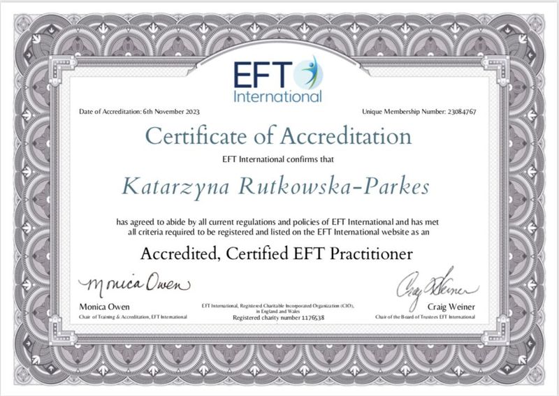 The image shows a certificate of accreditation issued by EFT International. The document is designed with ornate borders and includes the following elements:

- The title "Certificate of Accreditation"
- The logo of EFT International
- A statement confirming the accreditation of a person named Katarzyna Rutkowska-Parkes as an "Accredited, Certified EFT Practitioner"
- The date of accreditation: 6th November 2023
- A unique membership number
- Signatures from officials, including Monica Owen and Craig Weiner, along with their titles and roles within the organization.

The certificate indicates that the individual has met specific criteria and regulations required for certification.